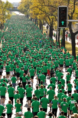 WARSAW, POLAND - OCTOBER 3  More than 9000 runners compete in the Run Warsaw a 10km race on through the main streets of city, October 3, 2010 in Warsaw, Poland のeditorial素材