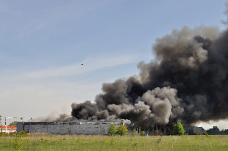 Wolka Kosowska, Poland - May 10, 2011 - Firefighters extinguish a raging fire in a China Mart...