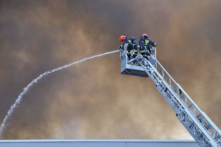 Wolka Kosowska, Poland - May 10, 2011 - Firefighters extinguish a raging fire in a China Mart storehouse.のeditorial素材