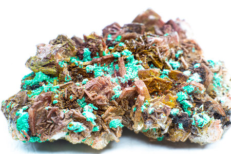 Real brown albite crystal cluster with small light green malachite clusters isolated on white. Macro