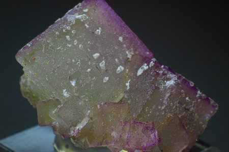 Macro purple cubical fluorite crystal cluster isolated on black backgroundの写真素材
