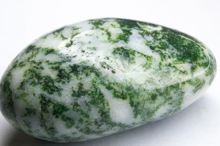 Close-up of a green agate stone on a white backgroundの写真素材