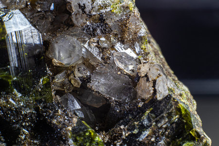 Ultra macro picture of quartz points with dark green epidote on matrix