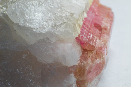Macro side photography of white quartz with pink tourmaline  - rubellite. Rose stone