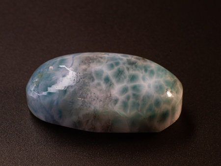 Larimar cabochon on black background macroの写真素材
