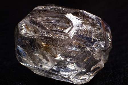 closeup of a crystal of natural quartz on a black background studioの写真素材
