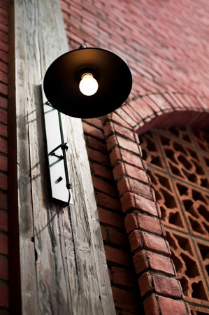Street lamp on a pattern wall.の写真素材