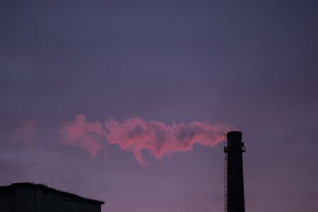 Purple smoke from factory chimneyの写真素材