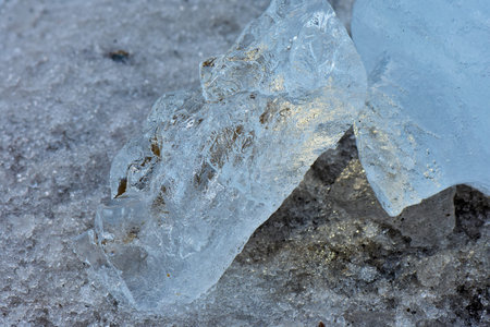 Ice stone on snow in cloudy day