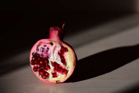 Half pomegranate with seedsの写真素材