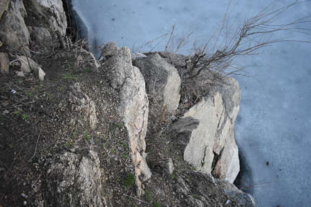 stone in the ice on the beachの写真素材