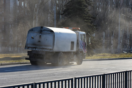 Dump truck on the road in the early spring. Moscow region, Russia