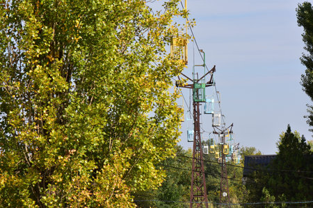 Autumn landscape with the image of the cable car in the city over the riverの写真素材
