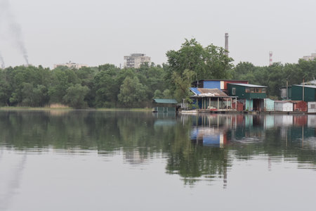 Houses on the bank of the river in the cityの写真素材