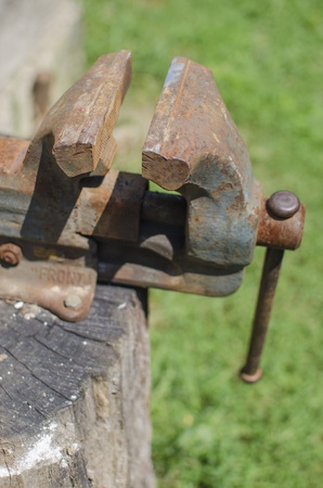 Steel vise clamp with green background.の写真素材