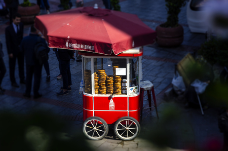 ISTANBUL, TURKEY - May 2, 2018: Famous tourist place Galata tower and Turkish Bagel Simit sale on nostalgia red car in Istanbul in Turkeyのeditorial素材