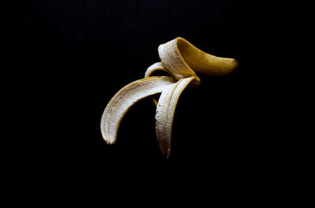 Banana peel isolated on blackの写真素材