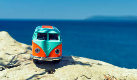 Vintage miniature orange and blue van. Travel conceptの写真素材