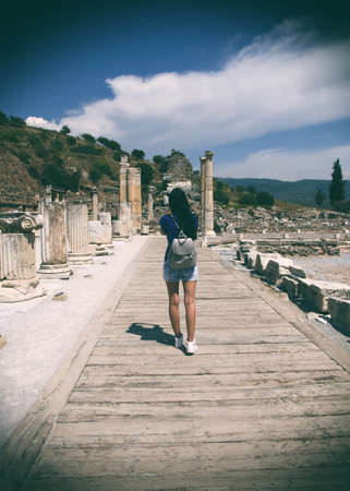 Female tourist enjoying sight of Ephesus ruins in Turkeyの写真素材