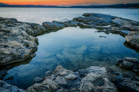 Dramatic sunset on the beachの写真素材