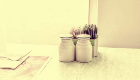 Salt and pepper on the table in the restaurant