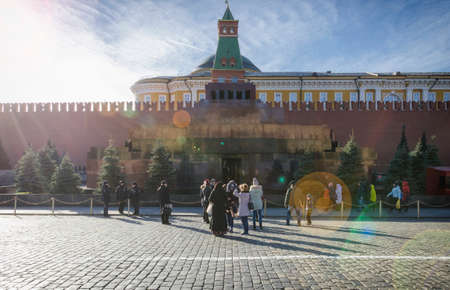 MOSCOW, Russia - November 02, 2017: The mausoleum with Lenin's body on Red Square, a wall and a tower of the Moscow Kremlin, tourists on Red Squareのeditorial素材
