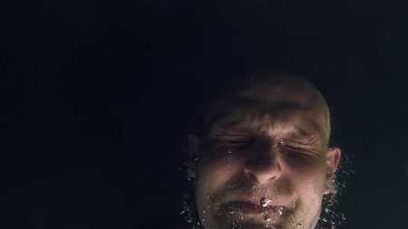 Underwater portrait of man with bubbles in a seaの写真素材