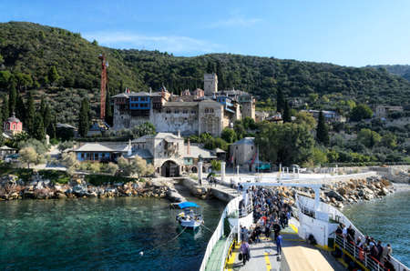 Ouranoupoli, GREECE - OCTOBER 22, 2017: Pilgrims leave the ferry at Dohyar Monastery on Athosのeditorial素材