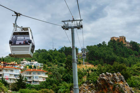 Alanya, Turkey - May 11, 2018: Cable car carrying tourists from city to Alanya castleのeditorial素材