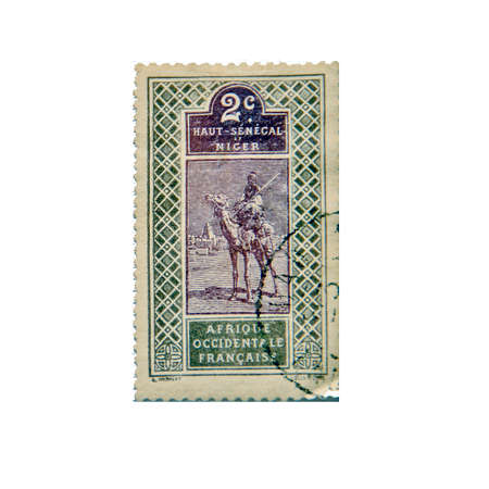NIGER - CA. 1915: Postage stamp ca. 1915 from Niger and Upper Senegal showing a traditional scene of a man on a camelのeditorial素材