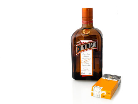 MOSCOW, RUSSIA - APRIL 17, 2015: Bottle of triple sec Cointreau and Cohiba cigars