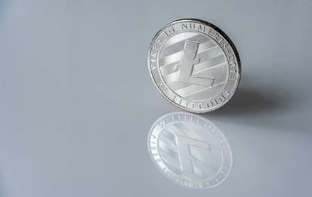 Mockup of digital currency silver Bitcoin (BTC) isolated on white with clipping path and smooth shadow.の写真素材