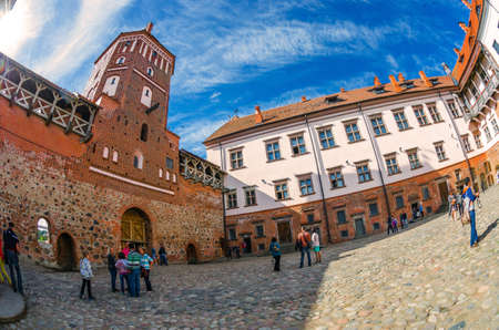 MIR, BELARUS - JUNE 13: Unidentified people walk near Mir Castle in Grodno Region, Belarus in June 13, 2014. The castle is a defensive fortification XVI-XVII centuryのeditorial素材
