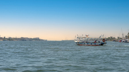 Luxor, Egypt - April 11, 2021: Tourists crossing the Nile in Luxor by boats. Traveling in Egypt.のeditorial素材