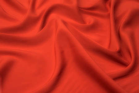 Close-up texture of natural red or pink fabric or cloth in same color. Fabric texture of natural cotton, silk or wool, or linen textile material. Red and pink canvas background.の写真素材