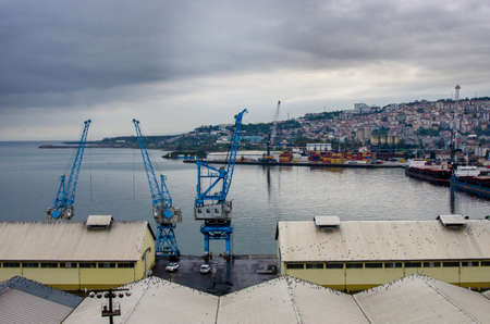 Trabzon, Turkey - October 9, 2018: Trabzon port, tankers and cranes at the eveningのeditorial素材
