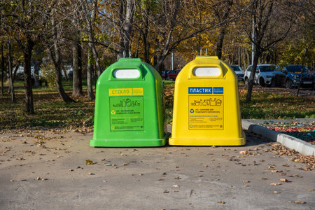 Moscow, Russia - October 11, 2021: Large yrellow and green containers for separate waste collection in Moscow, Russia.のeditorial素材