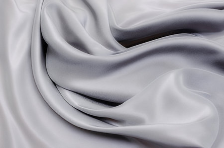 Close-up texture of natural gray or black fabric or cloth in same color. Fabric texture of natural cotton, silk or wool, or linen textile material. Black canvas background.の写真素材