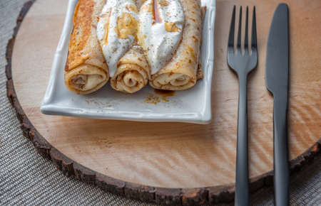 Tasty stuffed pancakes crepes with meat closeup. Thin pancakes with minced chicken. Russian Fried Stuffed Pancakes with Meat. food photography.の写真素材