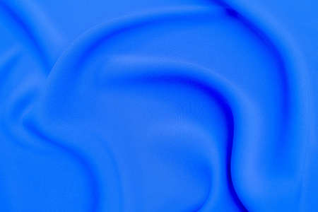 Close-up texture of natural blue fabric or cloth in same color. Fabric texture of natural cotton, silk or wool, or linen textile material. Blue canvas background.の写真素材