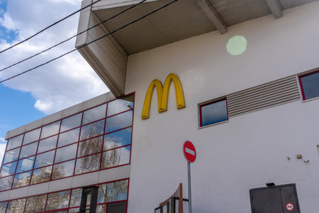 Moscow, Russia - April, 28, 2022. Logotype on facade McDonald's restaurant closed due to sanctions in Moscowのeditorial素材