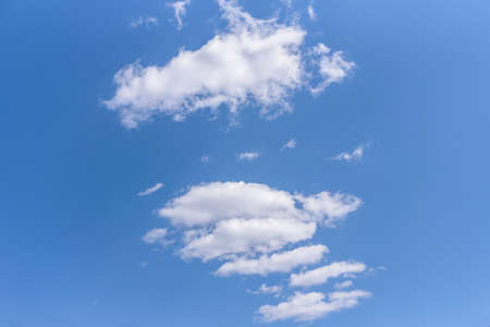 White clouds cumulus clouds floating on blue sky for background conceptの写真素材