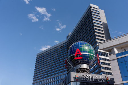 Moscow, Russia - May 05, 2022: Logotype of Alfa Bank on glass mockup of the Earth. Logo of private bank of Russia - Alfa Bank on building on the streetのeditorial素材