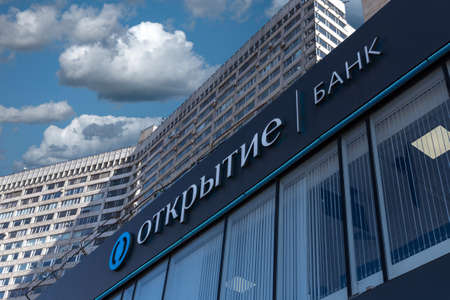 Moscow, Russia - May 05, 2022: The Bank "Opening" logotype on building facade on the street in Moscowのeditorial素材