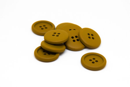 White buttons for clothes on white background using for concept of Button Day.