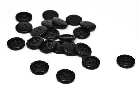 Colorfull buttons for clothes on white background using for concept of Button Day.