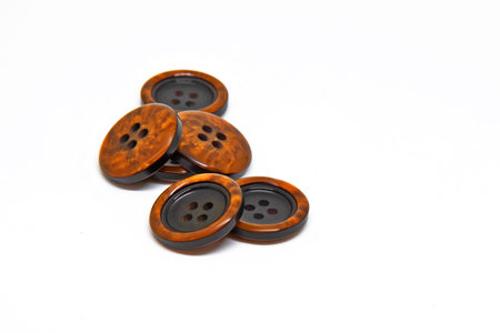 Colorfull buttons for clothes on white background using for concept of Button Day.