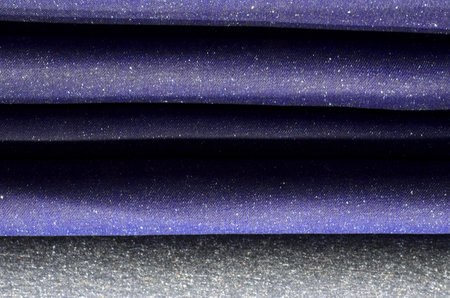Denim fabric dark blue, melange, dense.の写真素材