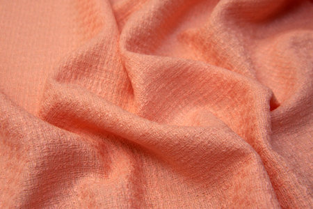 Close-up texture of natural red or pink or fuchsia fabric or cloth in same color. Fabric texture of natural cotton, silk or wool textile material. Red or pink or fuchsia fabric canvas background.の写真素材