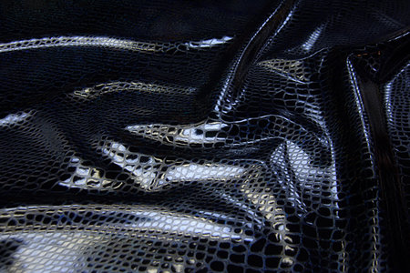 Abstract background texture of natural black color fabric. Fabric texture of natural cotton or...